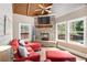 Cozy living room with stone fireplace and ample natural light at 90 Belleview Rdg, Sharpsburg, GA 30277