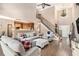 Spacious living room with soaring ceilings, natural light, and open layout to the kitchen, ideal for entertaining at 90 Belleview Rdg, Sharpsburg, GA 30277