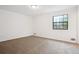 Neutral-toned bedroom with carpet and window allowing natural light at 10386 Wisteria Ln, Jonesboro, GA 30238