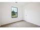 Bright bedroom featuring a neutral carpet and window at 10386 Wisteria Ln, Jonesboro, GA 30238