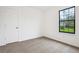 Bedroom with a window that provides natural light and soft carpet at 10386 Wisteria Ln, Jonesboro, GA 30238