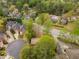 Aerial view of a neighborhood featuring mature trees, diverse architectural styles and a cul-de-sac at 1387 Church St, Decatur, GA 30030