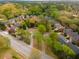 Gorgeous aerial view of homes nestled amongst lush trees within a vibrant, green residential neighborhood at 1387 Church St, Decatur, GA 30030