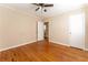 Bedroom featuring hardwood flooring, neutral walls, and a doorway at 1387 Church St, Decatur, GA 30030