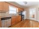 The kitchen has stainless steel appliances, granite counters, hardwood floors, and wooden cabinets at 1387 Church St, Decatur, GA 30030