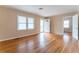 Inviting living room featuring hardwood floors, natural light, and a view to an adjacent room at 1387 Church St, Decatur, GA 30030
