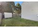 Grassy backyard with a storage shed and wood privacy fence at 206 Oak Grove Way, Acworth, GA 30102