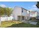 An open backyard with a patio and arbor offers lots of space at 206 Oak Grove Way, Acworth, GA 30102