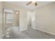 This bedroom offers sliding closet doors and a ceiling fan at 206 Oak Grove Way, Acworth, GA 30102