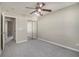 Spacious bedroom with grey carpet, mirrored closet and ceiling fan at 206 Oak Grove Way, Acworth, GA 30102