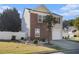 Charming two-story home featuring a brick facade, well-manicured lawn, and a quaint garden at 206 Oak Grove Way, Acworth, GA 30102