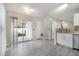View of the kitchen with stainless steel appliances and sliding doors to the backyard at 206 Oak Grove Way, Acworth, GA 30102