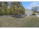 Large, grassy area features fenced-in playground set at 206 Oak Grove Way, Acworth, GA 30102