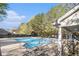 Community pool with ample seating in covered area at 206 Oak Grove Way, Acworth, GA 30102