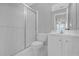 Bright bathroom featuring a shower, toilet, vanity with white cabinetry and neutral wall paint at 240 River Cove Mdws, Social Circle, GA 30025