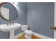Cozy half bathroom with stylish sink, toilet, and fixtures at 240 River Cove Mdws, Social Circle, GA 30025