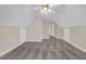 Spacious bedroom with carpet flooring, ceiling fan, neutral paint, and access to additional rooms at 240 River Cove Mdws, Social Circle, GA 30025