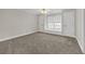 Comfortable bedroom with carpet, a window seat, and ample closet space at 240 River Cove Mdws, Social Circle, GA 30025