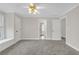 Spacious carpeted bedroom with ceiling fan at 240 River Cove Mdws, Social Circle, GA 30025