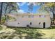 Exterior view of home with large grassy backyard at 293 Howell Sw Dr, Atlanta, GA 30331