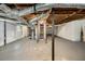 Unfinished basement with exposed pipes and stairs at 293 Howell Sw Dr, Atlanta, GA 30331