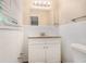 Bathroom features a granite vanity top and white tiled walls at 293 Howell Sw Dr, Atlanta, GA 30331