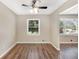 Bright dining area with wood floors and a ceiling fan at 293 Howell Sw Dr, Atlanta, GA 30331
