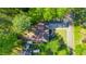Aerial view of the house featuring a driveway and treed backyard at 3578 Hope Rd, Cumming, GA 30041