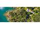 Stunning aerial view of Lake Hartwell's shoreline featuring private boat docks and wooded lots at 3578 Hope Rd, Cumming, GA 30041