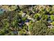 Aerial view showcasing the beautiful landscape with trees, homes and winding streets at 3578 Hope Rd, Cumming, GA 30041