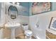 Stylish bathroom featuring pedestal sink, beadboard walls, and decorative accents at 3578 Hope Rd, Cumming, GA 30041