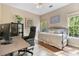 Comfortable bedroom featuring a daybed, desk and large window for natural light at 3578 Hope Rd, Cumming, GA 30041