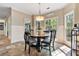 Bright breakfast nook featuring views to backyard, and decorative hanging light at 3578 Hope Rd, Cumming, GA 30041