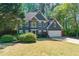 Charming two-story home with a well-manicured lawn and a two-car garage at 3578 Hope Rd, Cumming, GA 30041