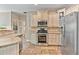 Well-equipped kitchen with stainless steel appliances, granite counters and ample storage at 3578 Hope Rd, Cumming, GA 30041