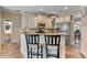 Charming kitchen with breakfast bar, pendant lights, and stainless steel appliances at 3578 Hope Rd, Cumming, GA 30041