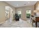 Sitting room with a piano and large windows providing an inviting atmosphere at 3578 Hope Rd, Cumming, GA 30041