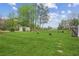 Large, grassy backyard featuring mature trees and plenty of open space at 140 Apple Valley Dr, Woodstock, GA 30188