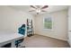 Bright bedroom features a ceiling fan, neutral walls and a window providing natural light at 140 Apple Valley Dr, Woodstock, GA 30188