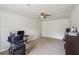 Spacious bonus room features carpeting, a ceiling fan and plenty of room for activities at 140 Apple Valley Dr, Woodstock, GA 30188