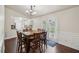 Dining room with a large table, chairs, and french doors leading to the outside at 140 Apple Valley Dr, Woodstock, GA 30188