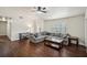 Inviting living room with hardwood floors, a comfortable sectional sofa, and ample natural light at 140 Apple Valley Dr, Woodstock, GA 30188