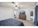 Comfortable primary bedroom featuring a king-size bed, dresser, and ensuite bathroom at 140 Apple Valley Dr, Woodstock, GA 30188