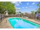 Backyard pool with a surrounding patio and a privacy fence providing a refreshing escape at 140 Apple Valley Dr, Woodstock, GA 30188
