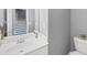 Bathroom sink and toilet, next to the stairwell and with grey walls at 2180 Mill Garden Run, Buford, GA 30519