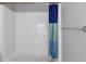 Neat and clean shower and shower curtain with contrasting colors with a towel rack on the right at 2180 Mill Garden Run, Buford, GA 30519