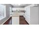 Updated kitchen featuring white cabinets and stainless steel appliances at 2180 Mill Garden Run, Buford, GA 30519