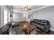 Bright living room with hardwood floors, a fireplace, and gray walls at 2180 Mill Garden Run, Buford, GA 30519