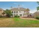 Well-manicured backyard showcasing a spacious patio area, perfect for entertaining guests with ample green space at 3022 Woodbridge Ln, Canton, GA 30114