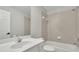 Clean bathroom with a white vanity, tile surround shower, and neutral decor at 3022 Woodbridge Ln, Canton, GA 30114